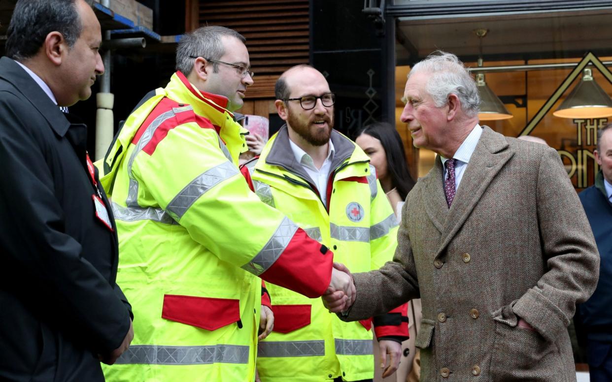 Prince Charles met emergency service workers and local residents in Pontypridd, south Wales, which has been hit by heavy flooding - Chris Jackson/Pool via REUTERS