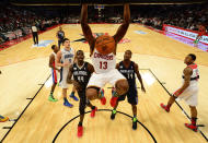 Cleveland Cavaliers Tristan Thompson (13) hangs on the rim after a dunk during the first half of the NBA BBVA Rising Star Challenge basketball game in Houston, Texas, February 15, 2013. REUTERS/Bob Donnan/Pool (UNITED STATES - Tags: SPORT BASKETBALL) - RTR3DUYA