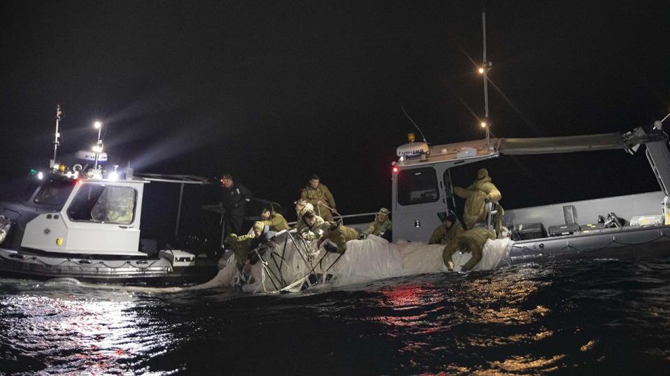 Sailors assigned to Explosive Ordnance Disposal Group 2 recover a high-altitude surveillance balloon off the coast of Myrtle Beach, South Carolina, Feb. 5, 2023. EODGRU 2 is a critical part of the Navy Expeditionary Combat Force that clears explosive hazards to provide access to denied areas; secures the undersea domain for freedom of movement; builds and fosters relationships with trusted partners, and protects the homeland. At the direction of the President of the United States and with the full support of the Government of Canada, U.S. fighter aircraft under U.S. Northern Command authority engaged and brought down a high altitude surveillance balloon within sovereign U.S. airspace and over U.S. territorial waters Feb. 4, 2023.  Active duty, Reserve, National Guard, and civilian personnel planned and executed the operation, and partners from the U.S. Coast Guard, Federal Aviation Administration, and Federal Bureau of Investigation ensured public safety throughout the operation and recovery efforts.