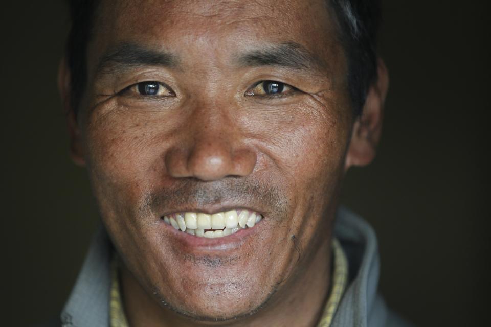 FILE- Nepalese veteran Sherpa guide, Kami Rita, 48, poses for a photograph at his rented apartment in Kathmandu, Nepal, March 26, 2018. Rita scaled Mount Everest Tuesday, May 23, 2023, for the 28th time beating his own record within a week as two guides compete with each other for the title of most climbs of the world's highest peak. (AP Photo/Niranjan Shrestha, File)