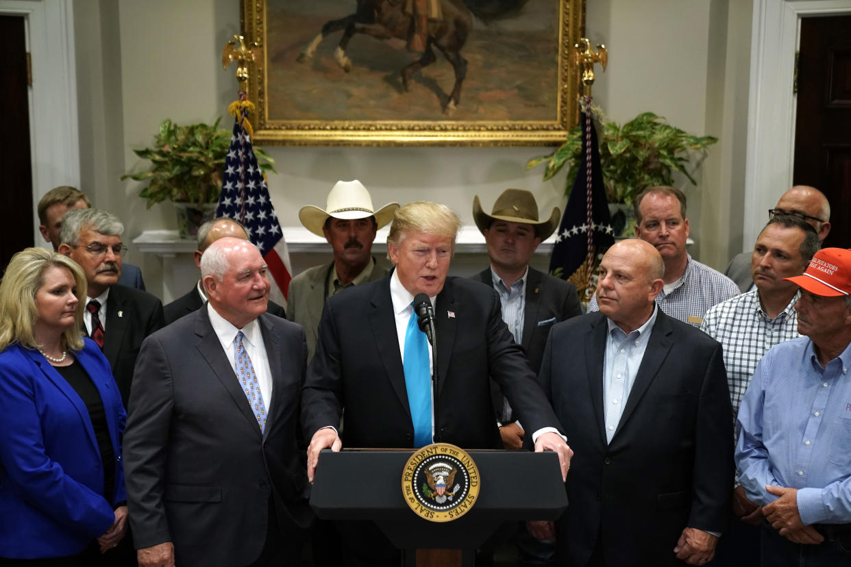 WASHINGTON, DC - MAY 23: U.S. President Donald Trump delivers remarks in support of farmers and ranchers with Agriculture Secretary Sonny Perdue (3rd L) in the Roosevelt Room at the White House May 23, 2019 in Washington, DC. As the U.S.-China trade war continues to hurt American farmers with tariffs on everything from peanut butter to soybeans and orange juice, the federal government announced Thursday it will give an additional $16 billion bailout to those most affected. (Photo by Chip Somodevilla/Getty Images)