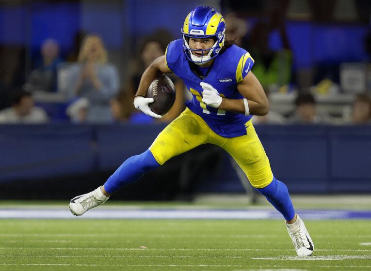 Rams wide receiver Puka Nacua runs after a catch against the Saints.