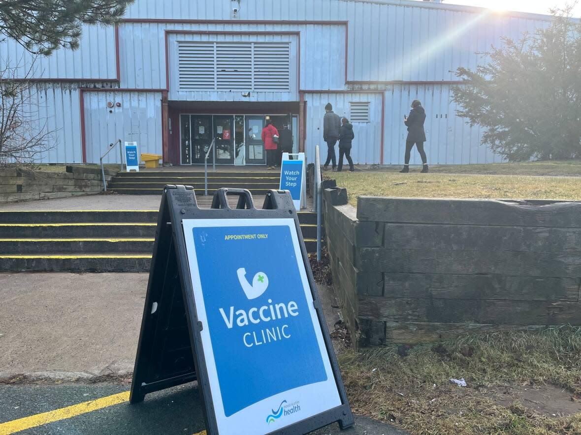 People line up outside of the COVID-19 vaccine booster clinic at the Halifax Forum on Jan. 6. (Cassie Williams/CBC - image credit)
