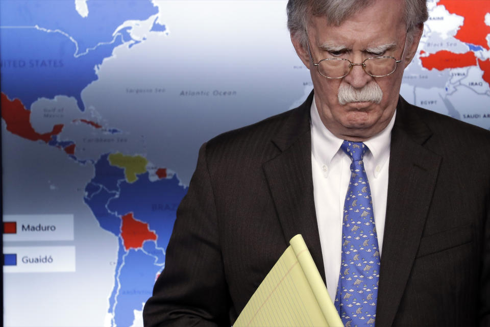 FILE - In this Jan. 28, 2019 file photo, national security adviser John Bolton listens during a press briefing regarding the Trump administration sanctions on Venezuela's state-owned oil company, at the White House, in Washington. The sanctions cut off one of Nicolas Maduro's most important sources of income and foreign currency along with around $7 billion in assets of state-owned Petroleos de Venezuela SA. Bolton warned that any move by Maduro against Guaido "will be met with a significant response." (AP Photo/ Evan Vucci, File