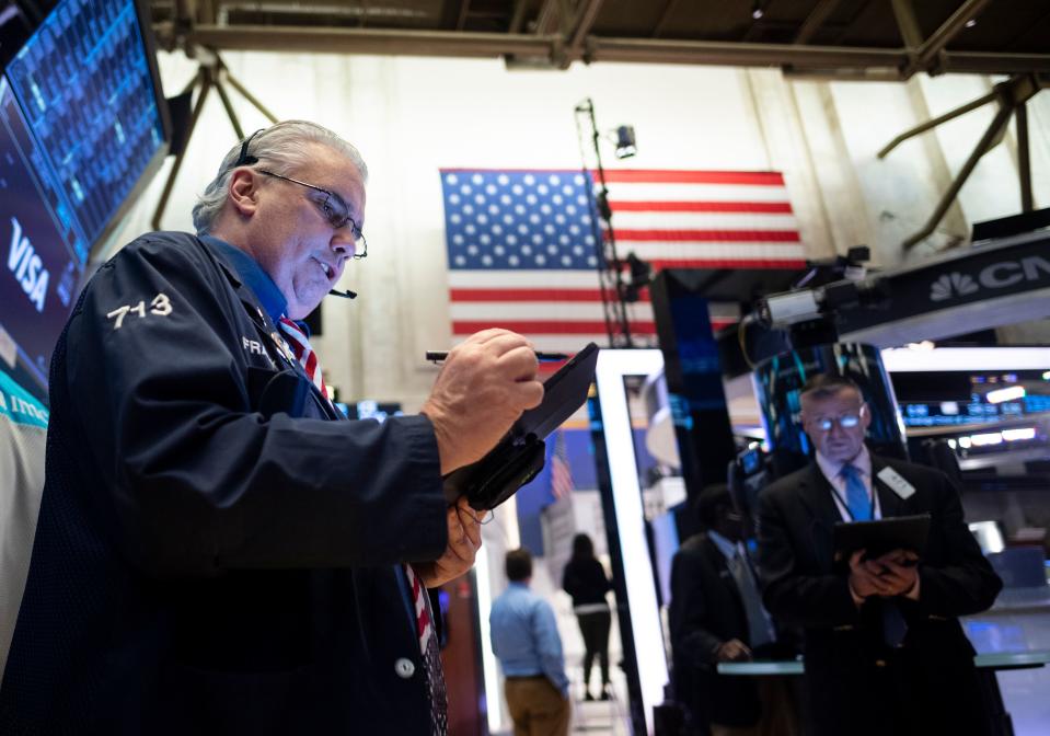 Traders work during the opening bell at the New York Stock Exchange (NYSE) on March 13, 2020 at Wall Street in New York City. (Photo by Johannes EISELE / AFP) (Photo by JOHANNES EISELE/AFP via Getty Images)