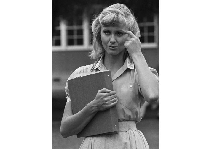 FILE - Actress and singer Olivia Newton-John appears on the set of "Grease," in Los Angeles on Aug. 30, 1977. Newton-John, a longtime resident of Australia whose sales topped 100 million albums, died Monday at her southern California ranch, John Easterling, her husband, wrote on Instagram and Facebook. She was 73. (AP Photo/Nick Ut, File)