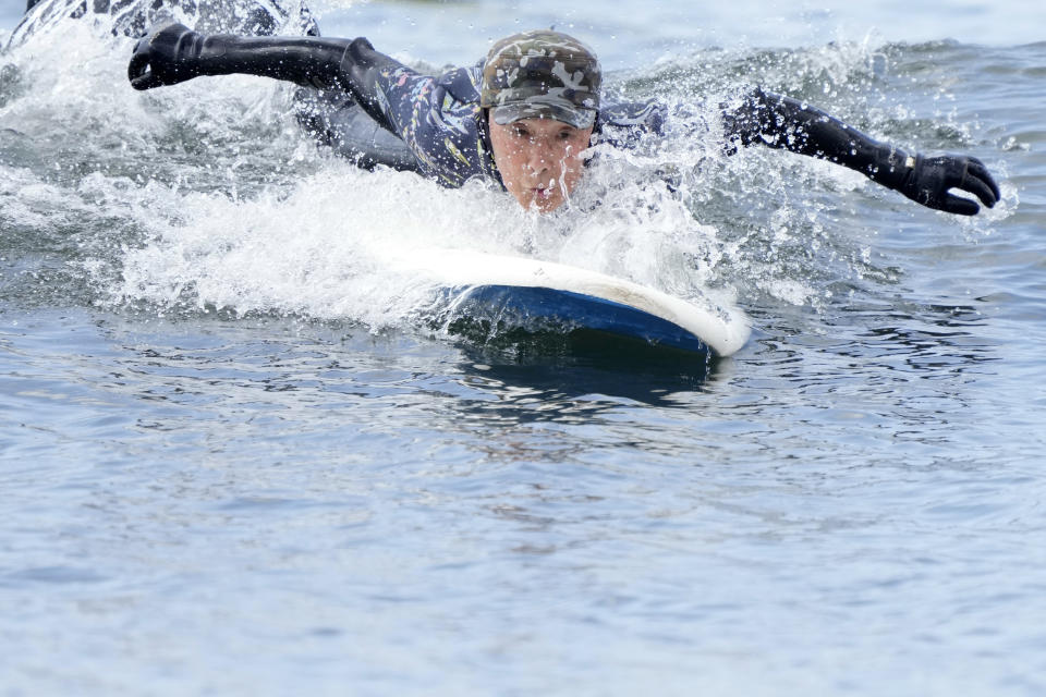 Seiichi Sano, an 89-year-old Japanese man, tries to ride a wave at Katase Nishihama Beach, Thursday, March 30, 2023, in Fujisawa, south of Tokyo. Sano, who turns 90 later this year, has been recognized by the Guinness World Records as the oldest male to surf. (AP Photo/Eugene Hoshiko)