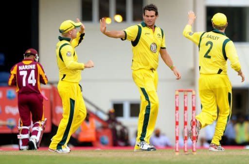 Australia's Clint McKay (C) celebrates with teammates after dismissing West Indies batsman Sunil Narine (L) during the fifth-of-five one-day internationals (ODIs) between West Indies and Australia at the Beausejour Cricket Ground in Gros Islet, St. Lucia, March 25. West Indies' hopes of a first series win over Australia in 17 years were shattered when the tourists clinched a 30-run victory