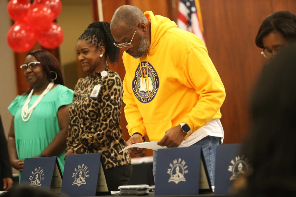 Principals and Literacy Mid-South representatives can be seen getting ready to sign certificates during the Memphis-Shelby County Schools and Literacy Mid-South Partnership Ceremony on Thursday, October 19, 2023 at the MSCS COE Auditorium in Memphis, Tenn.