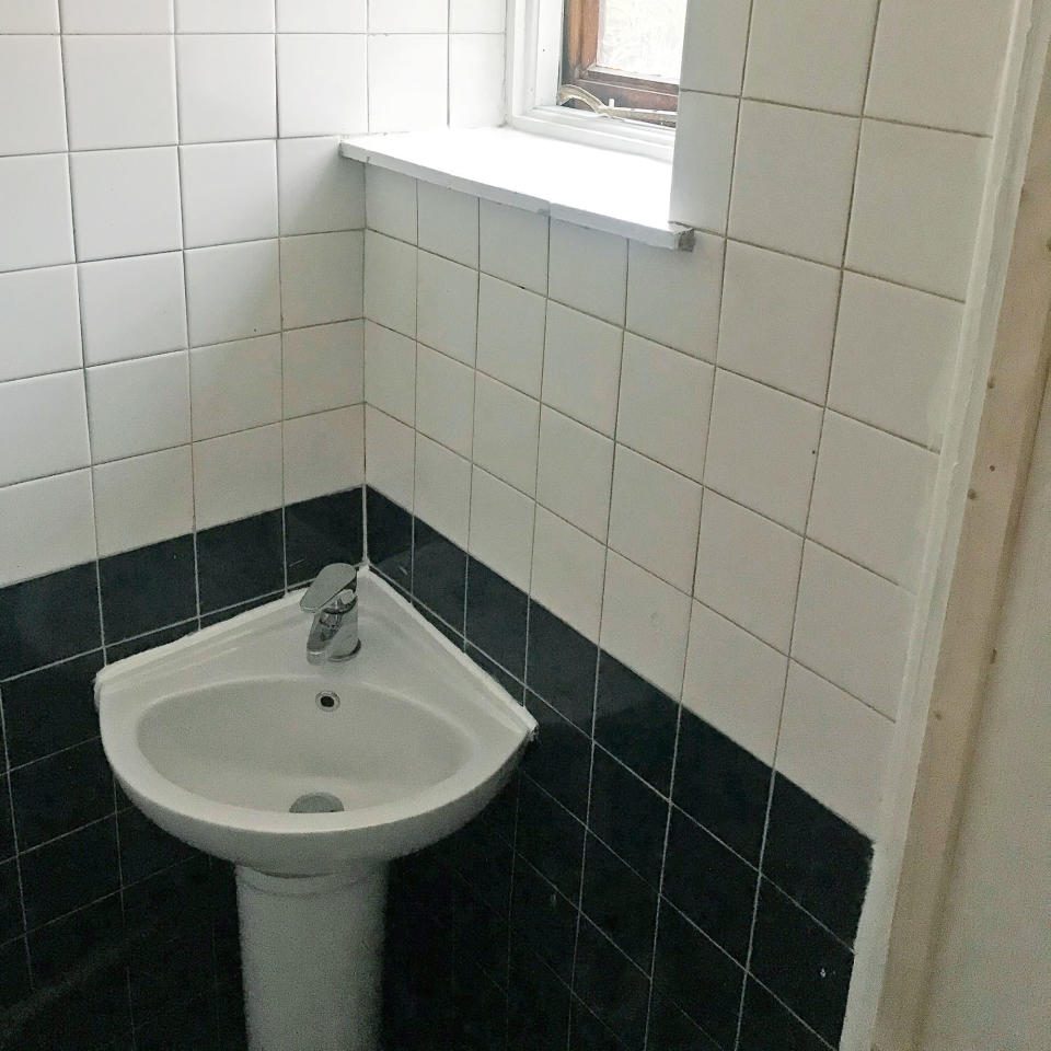 Before shot of a cloakroom with a corner sink