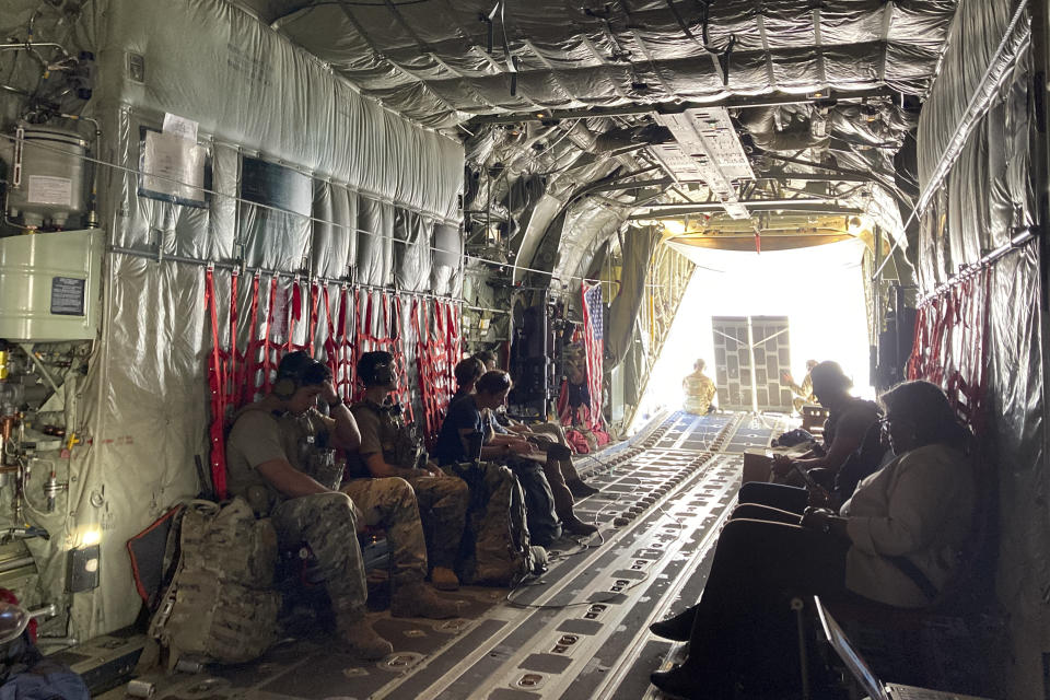 The U.S. ambassador to the United Nations, Linda Thomas-Greenfield, right, sits on a military transport plane as it prepares to depart from Mogadishu, Somalia Sunday, Jan. 29, 2023. The first U.S. Cabinet member to visit Somalia in nearly a decade is urging the world's distracted donors to give immediate help to a country facing deadly famine, which she calls "the ultimate failure of the international community." (AP Photo/Cara Anna)