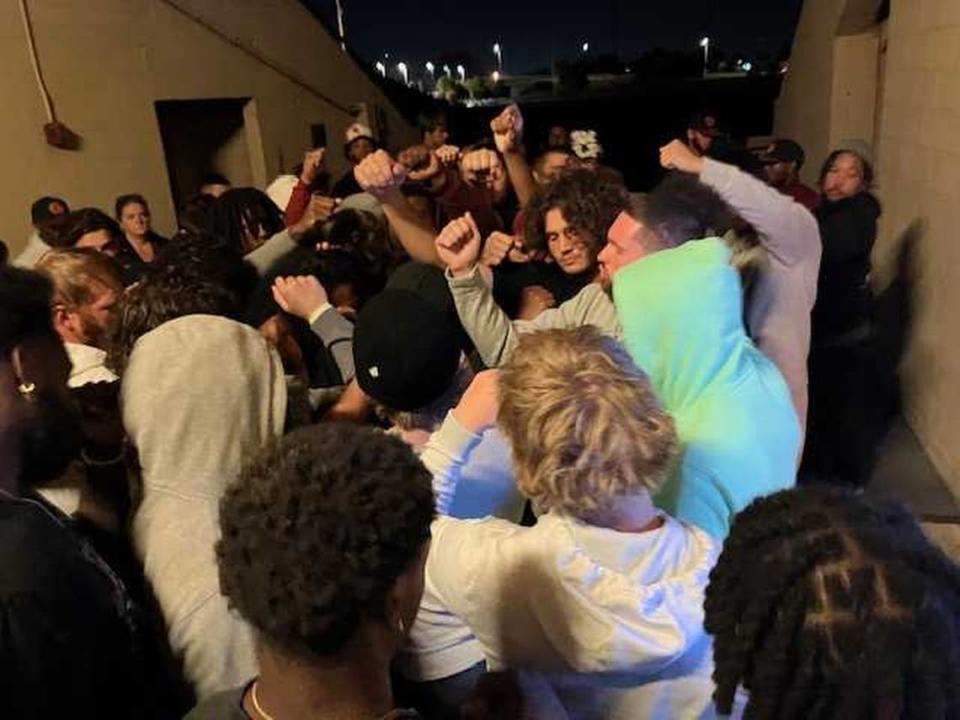 Quarterback Sean Nixon and other members of the Sacramento City College football team concluded a vigil Monday, Sept. 11, 2023, for teammate Justin McAllister with a team break at Hughes Stadium. McAllister died earlier in the evening after conditioning drills.