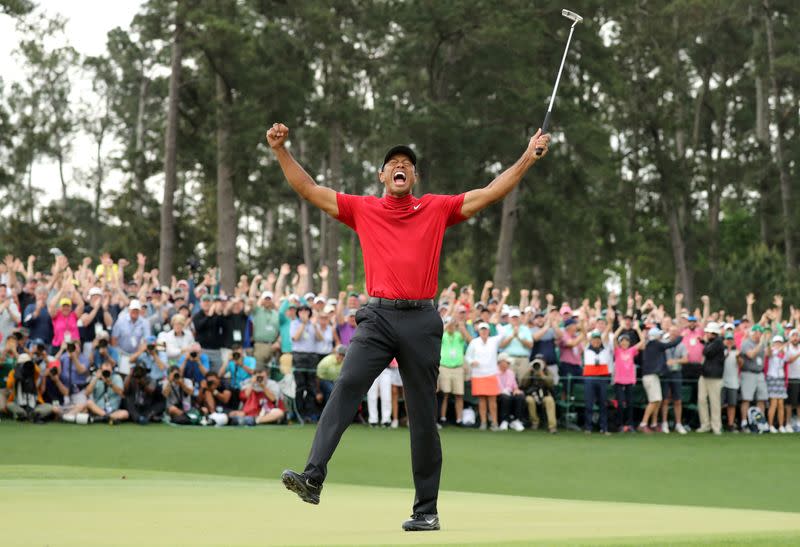 FILE PHOTO: Tiger Woods of the U.S. celebrates on the 18th hole to win the 2019 Masters