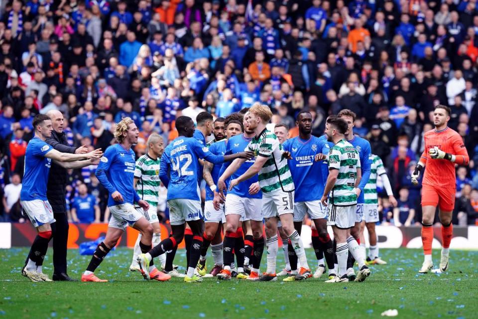 Rangers and Celtic players on the pitch after the final whistle of the Old Firm game on Sunday, April 7 <i>(Image: PA)</i>