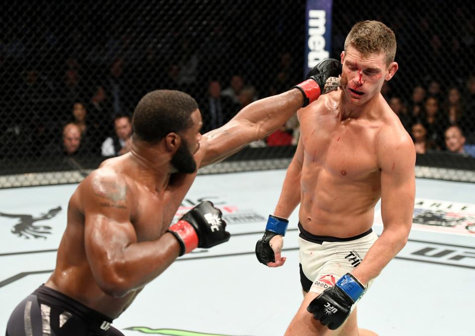 <p>Tyron Woodley of the United States (right) fights against Stephen Thompson of the United States in their welterweight championship bout during the UFC 205 event at Madison Square Garden on November 12, 2016 in New York City. (Photo by Jeff Bottari/Zuffa LLC/Zuffa LLC via Getty Images) </p>