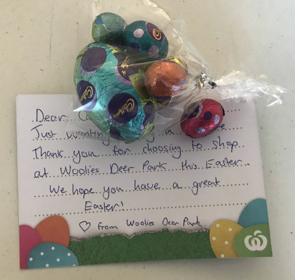 The bag of Easter chocolates and a handwritten card from Woolworths.