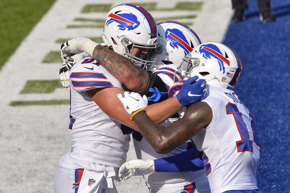 Buffalo Bills' Tyler Kroft, left, celebrates with teammates after catching a pass for a touchdown during the second half of an NFL football game against the Los Angeles Rams Sunday, Aug. 26, 2018, in Orchard Park, N.Y. The Bills won 35-32. (AP Photo/Adrian Kraus)