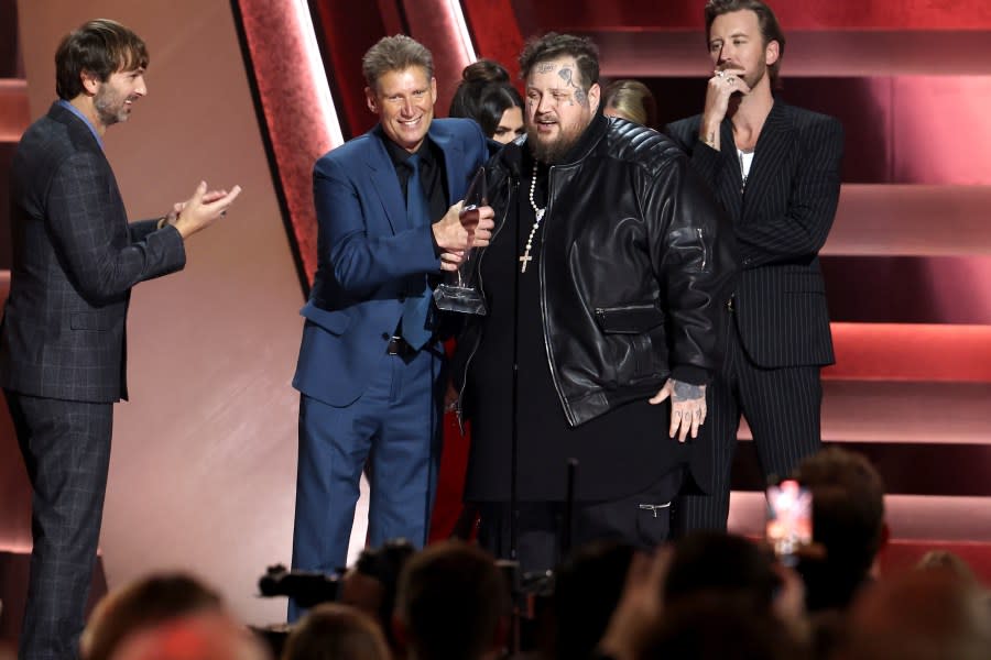Jelly Roll (R) accepts the New Artist of the Year award from Gerry Turner (L) onstage during the 57th Annual CMA Awards at Bridgestone Arena on November 08, 2023 in Nashville, Tennessee. (Photo by Terry Wyatt/Getty Images)