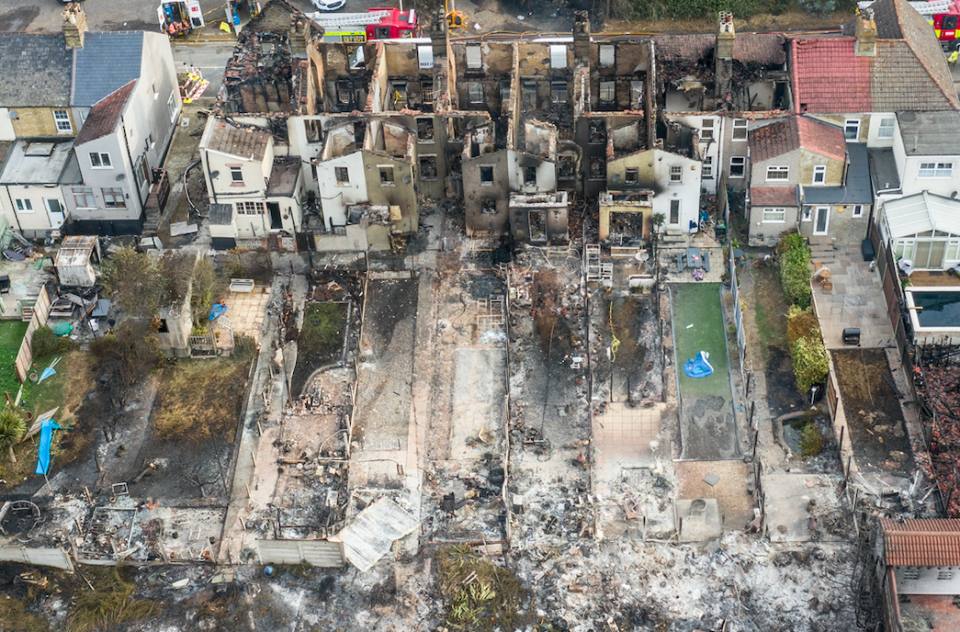 Homes in Wennington lie shelled out this morning after fires ripped through the properties. (SWNS)