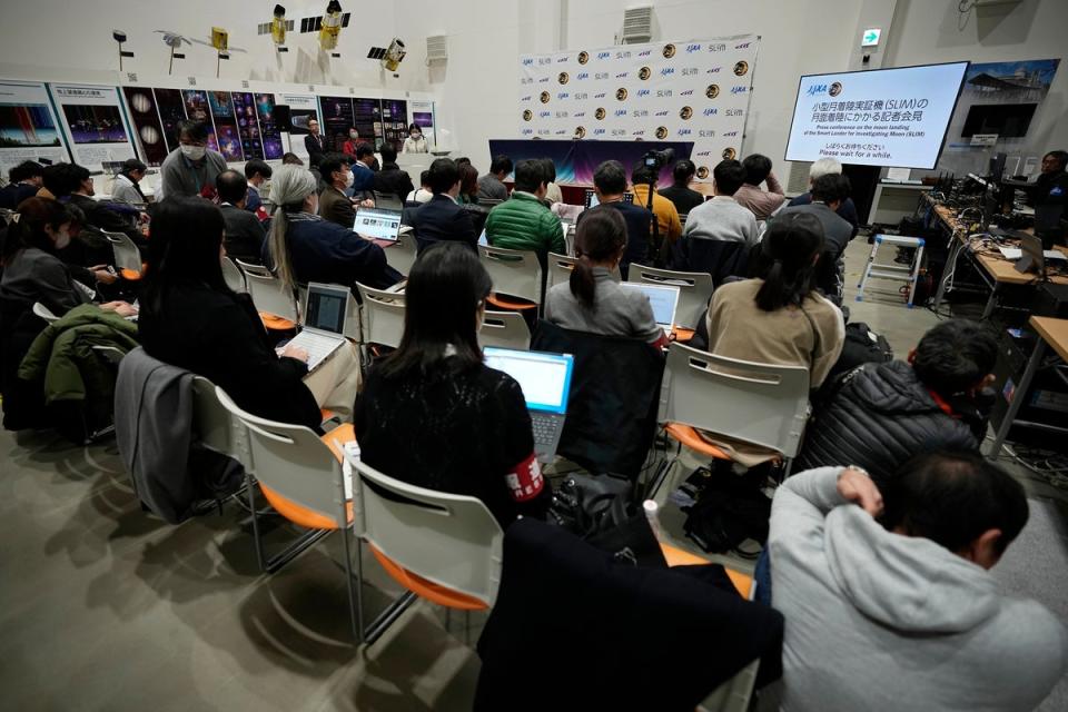 Journalists wait for an update on the success of the moon landing at JAXA’s Sagamihara Campus near Tokyo (Eugene Hoshiko/AP)