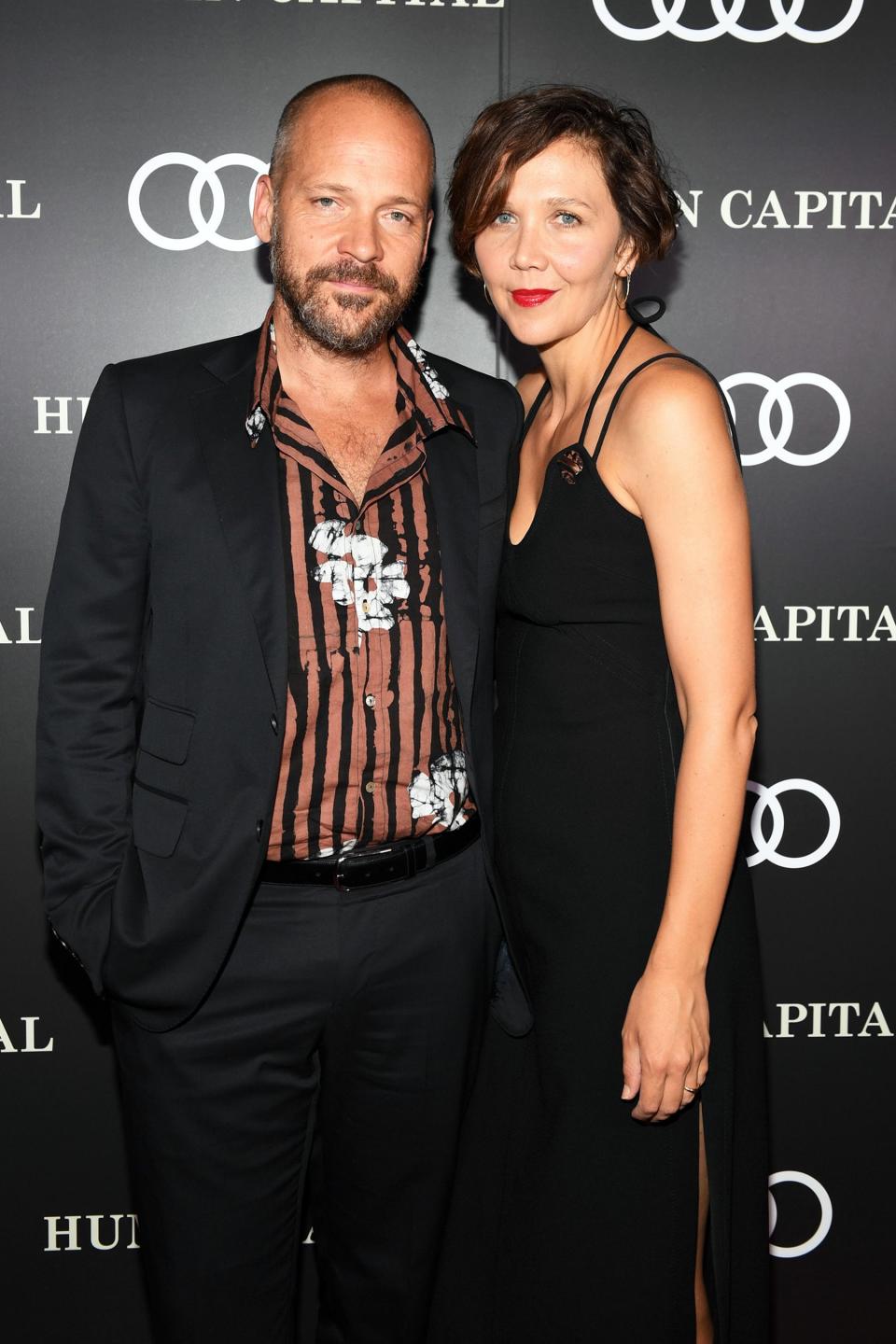 Peter Sarsgaard and wife Maggie Gyllenhaal pose together at Audi Canada’s post-screening event for <em>Human Capital</em> on Tuesday during the Toronto International Film Festival.