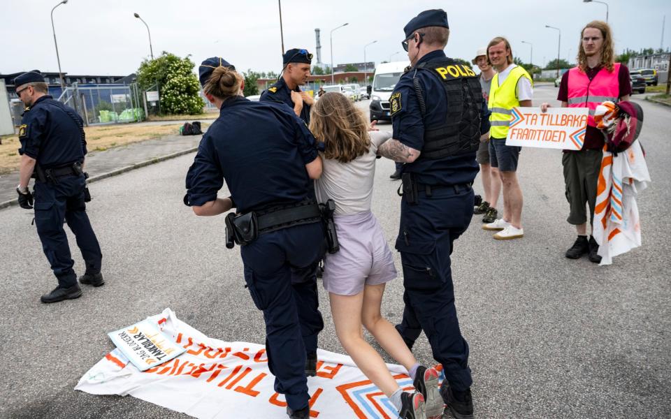 Greta being carried away by police