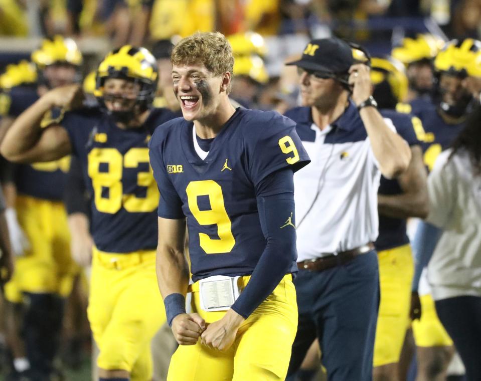 Michigan quarterback J.J. McCarthy celebrates on the sidelines during the second half of the 56-10 win over Hawaii on Saturday, Sept. 10, 2022, in Ann Arbor.