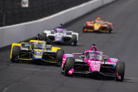 Simon Pagenaud, of France, drives into the first turn during practice for the IndyCar auto race at Indianapolis Motor Speedway in Indianapolis, Thursday, May 19, 2022. (AP Photo/Michael Conroy)