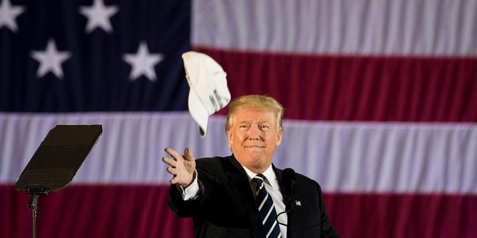 Trump throws hat