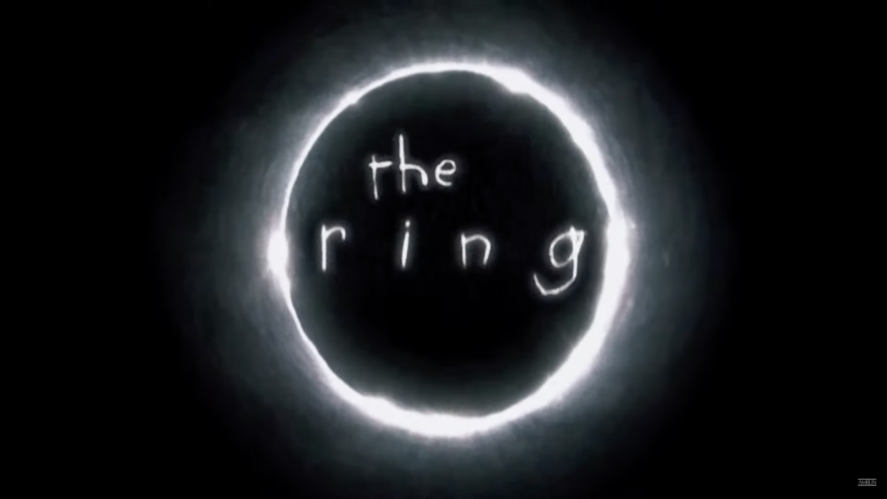  The logo for The Ring movie, with a circle around the title of the movie, written creepily. 