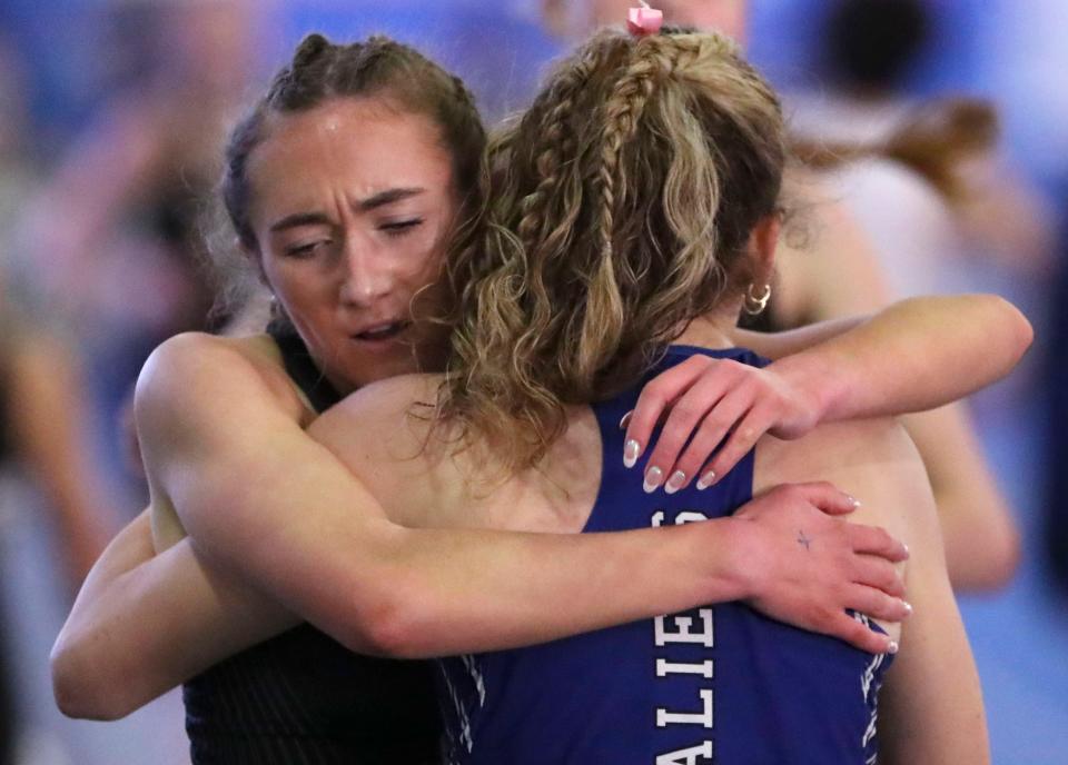 Second-place finisher Molly Flanagan of Padua (left) and first-place finisher Isabelle Walsh of Middletown congratulate each other after running the 800 meter race during the DIAA indoor track and field championships at the Prince George's Sports and Learning Complex in Landover, Md., Saturday, Feb. 3, 2023.