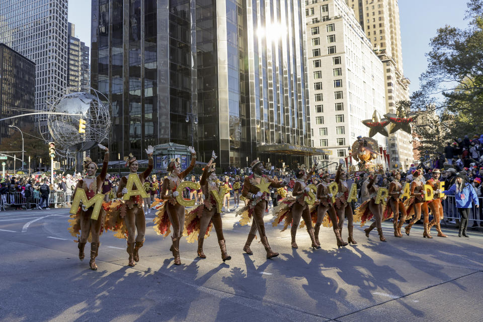 Performers walk through Columbus Circle during the Macy's Thanksgiving Day Parade, Thursday, Nov. 24, 2022, in New York. (AP Photo/Jeenah Moon)