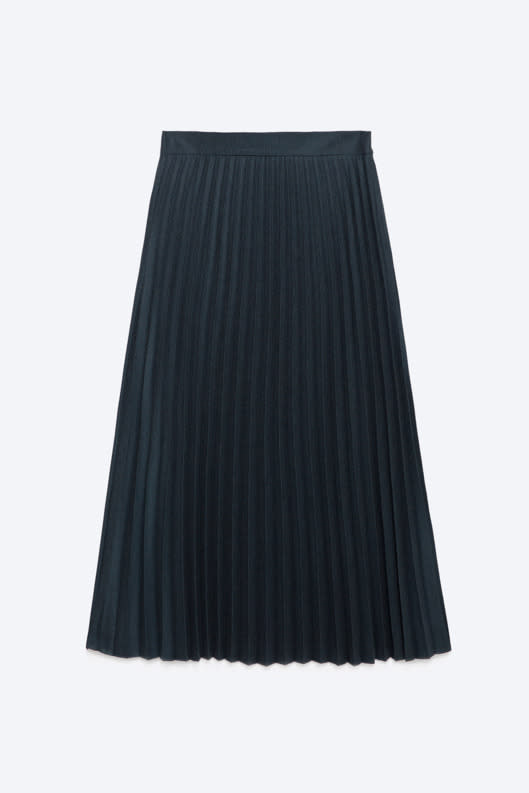 If you don’t want to go too outside your dark and dreary comfort zone, this deep-blue pleated skirt worn with a slim black turtleneck and ankle boots is a nice compromise. 