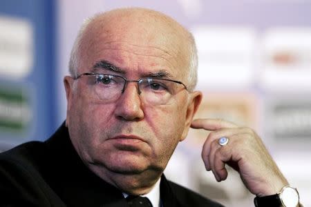 Italian Football Federation President Carlo Tavecchio attends a media conference during the official presentation of new Italy coach Antonio Conte (unseen) in Rome August 19, 2014. REUTERS/Alessandro Bianchi