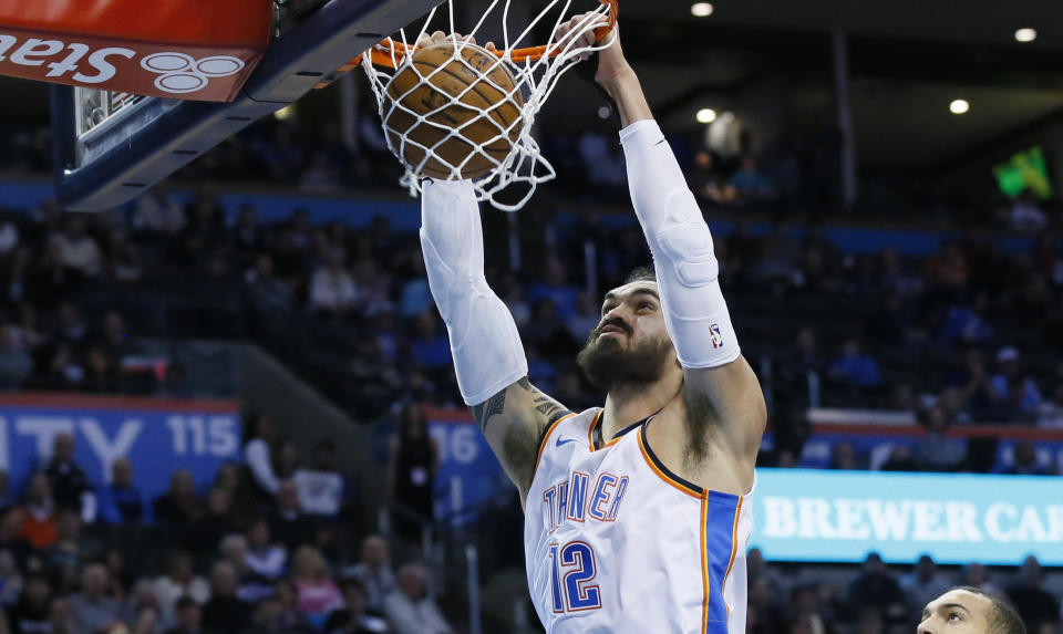 Rudy Gobert can only watch as Steven Adams dunks again. (AP)