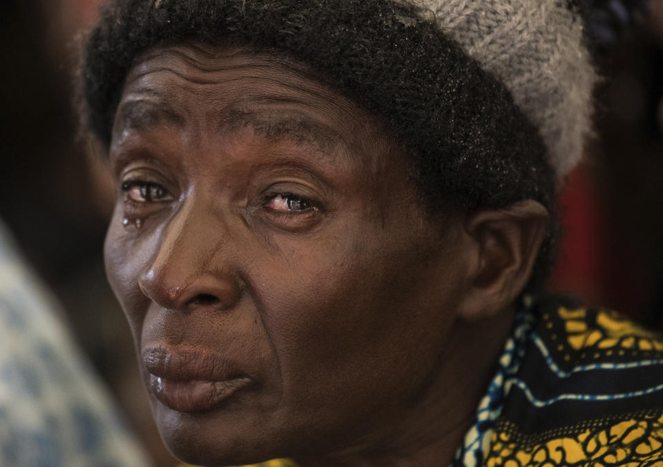 A grief-stricken woman cries during the burial ceremony of some of the people who lost their lives following heavy rains caused by Cyclone Freddy in Blantyre, southern Malawi, Wednesday, March 15, 2023. After barreling through Mozambique and Malawi since late last week and killing hundreds and displacing thousands more, the cyclone is set to move away from land bringing some relief to regions who have been ravaged by torrential rain and powerful winds. (AP Photo/Thoko Chikondi)