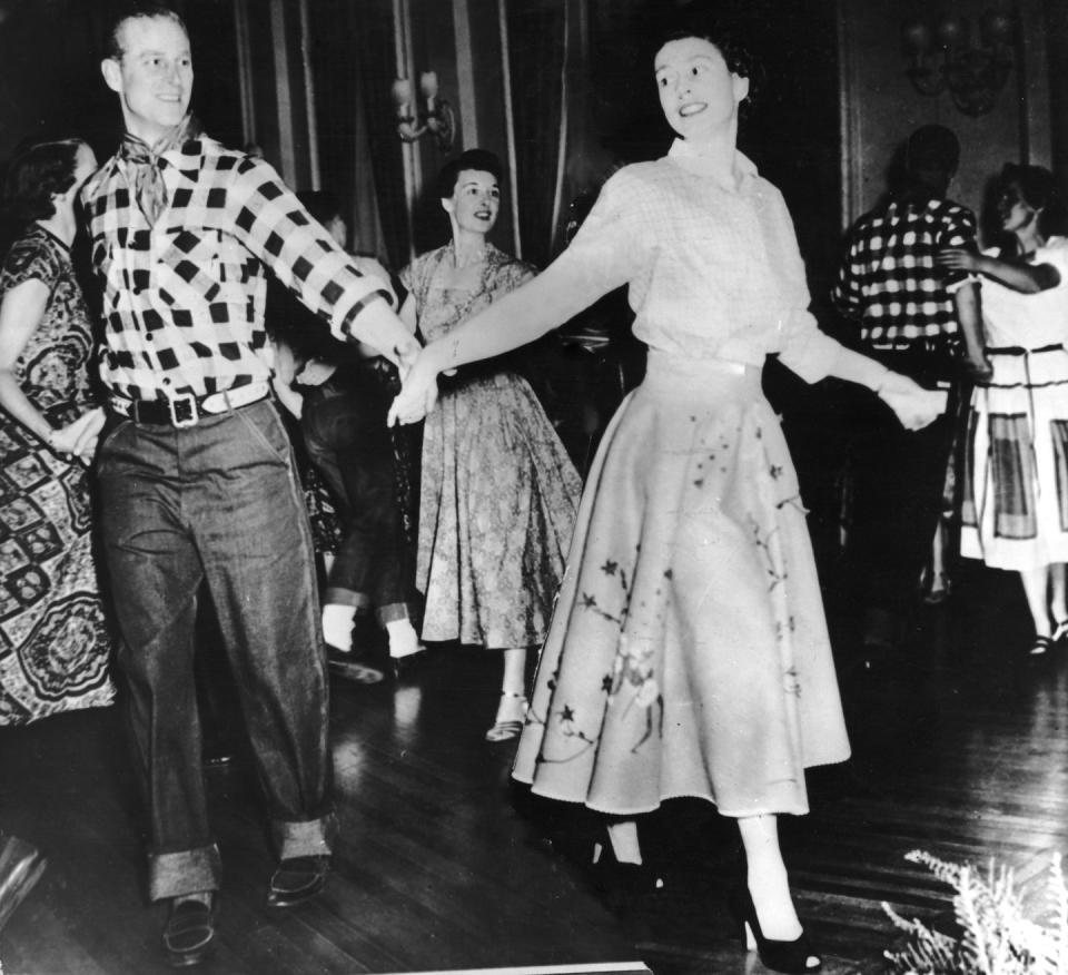 <p>The power of a good two-step knows no bounds. The Duke of Edinburgh and then-Princess Elizabeth attend a square dance in Ottawa while touring Canada. </p><p><strong>MORE:</strong> <a href="https://www.townandcountrymag.com/style/fashion-trends/g2792/royal-family-in-plaid-outfits/" rel="nofollow noopener" target="_blank" data-ylk="slk:Times the Royal Family Killed It in Plaid;elm:context_link;itc:0;sec:content-canvas" class="link ">Times the Royal Family Killed It in Plaid</a></p>
