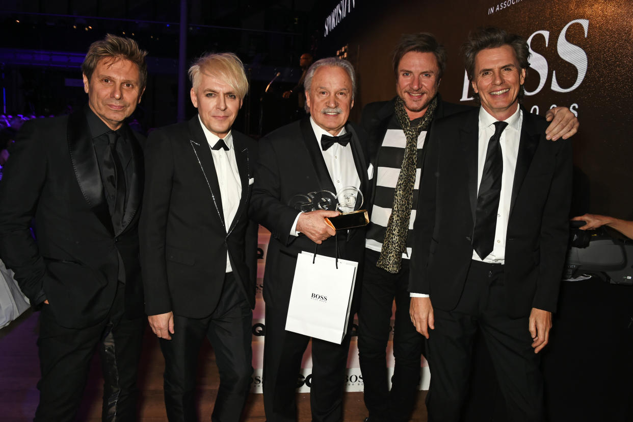 Giorgio Moroder (C), winner of the Inspiration of the Year Award, poses with Roger Taylor, Nick Rhodes, Simon Le Bon, and John Taylor of Duran Duran at the GQ Men Of The Year Awards at the Royal Opera House in 2015. (Photo: David M. Benett/Dave Benett/Getty Images)