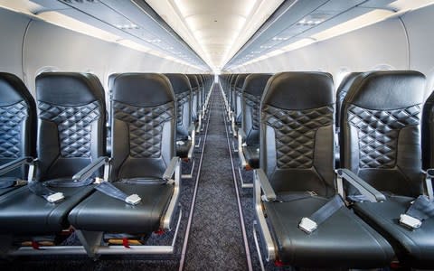 The interior of a Titan Airways A320 aircraft - Credit: Richard Martin