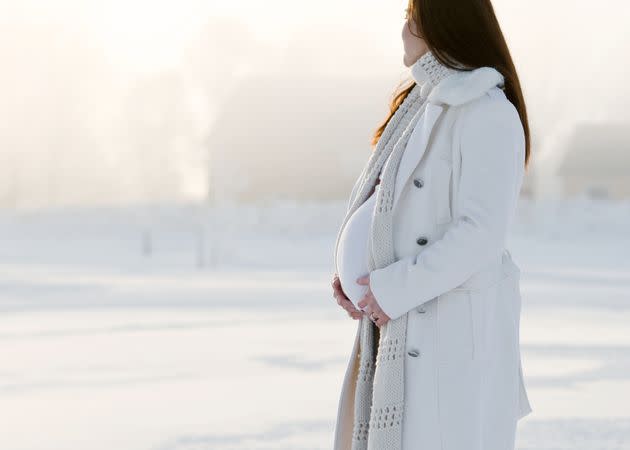 Upgrade your maternity wardrobe to get you through a cold-weather pregnancy. (Photo: judewood via Getty Images)