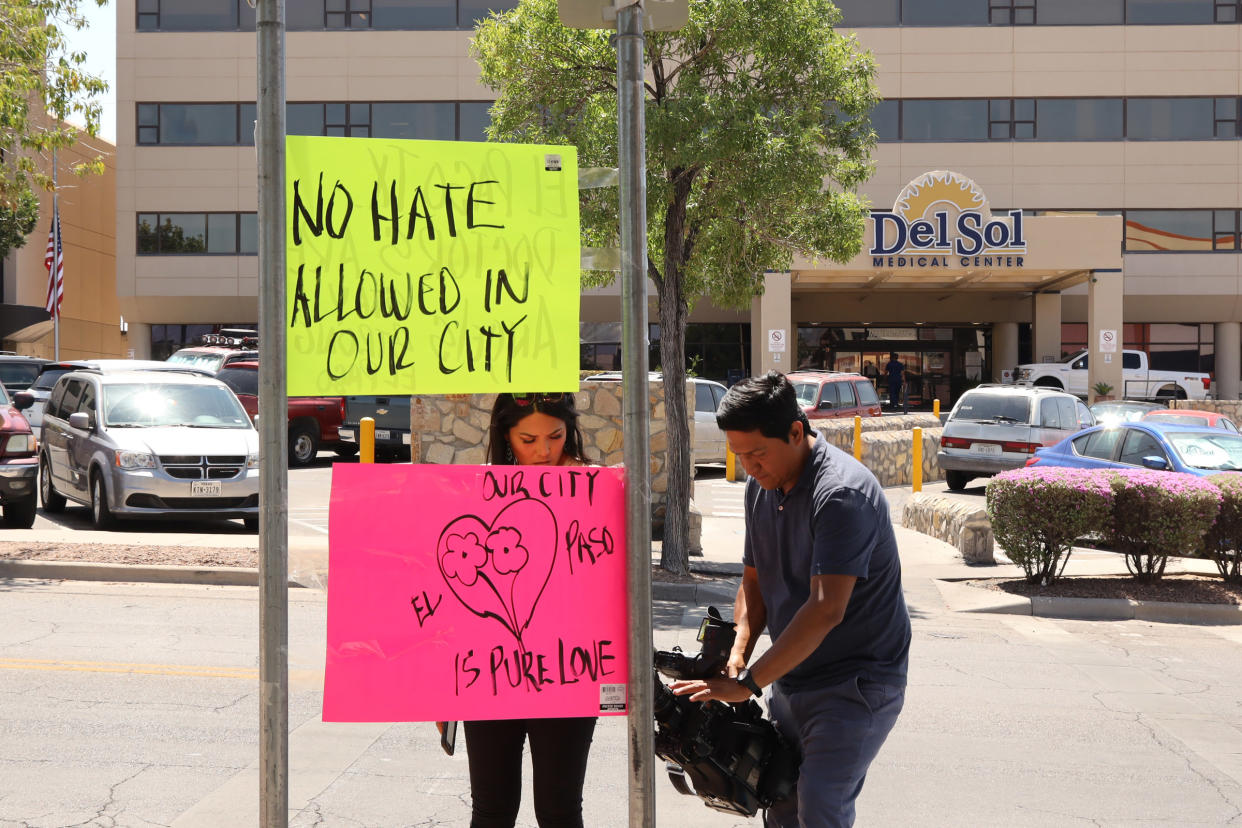 Residents in El Paso hang posters outside the Del Sol Medical Center, where many of the victims of a mass shooting were transported. (Photo by Liu Liwei/Xinhua via Getty) (Xinhua/Liu Liwei via Getty Images)