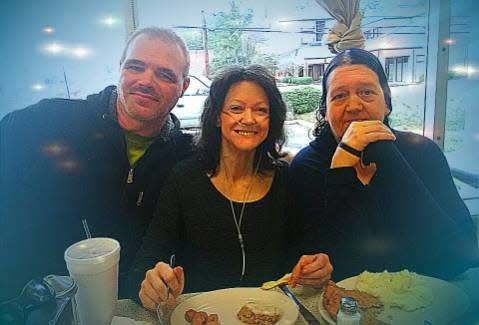 Ernest Chandler (left) is pictured with his friend Janet Hall Johnston (center) and her sister. Johnston died about three years ago but before that, Chandler promised to take care of her son.