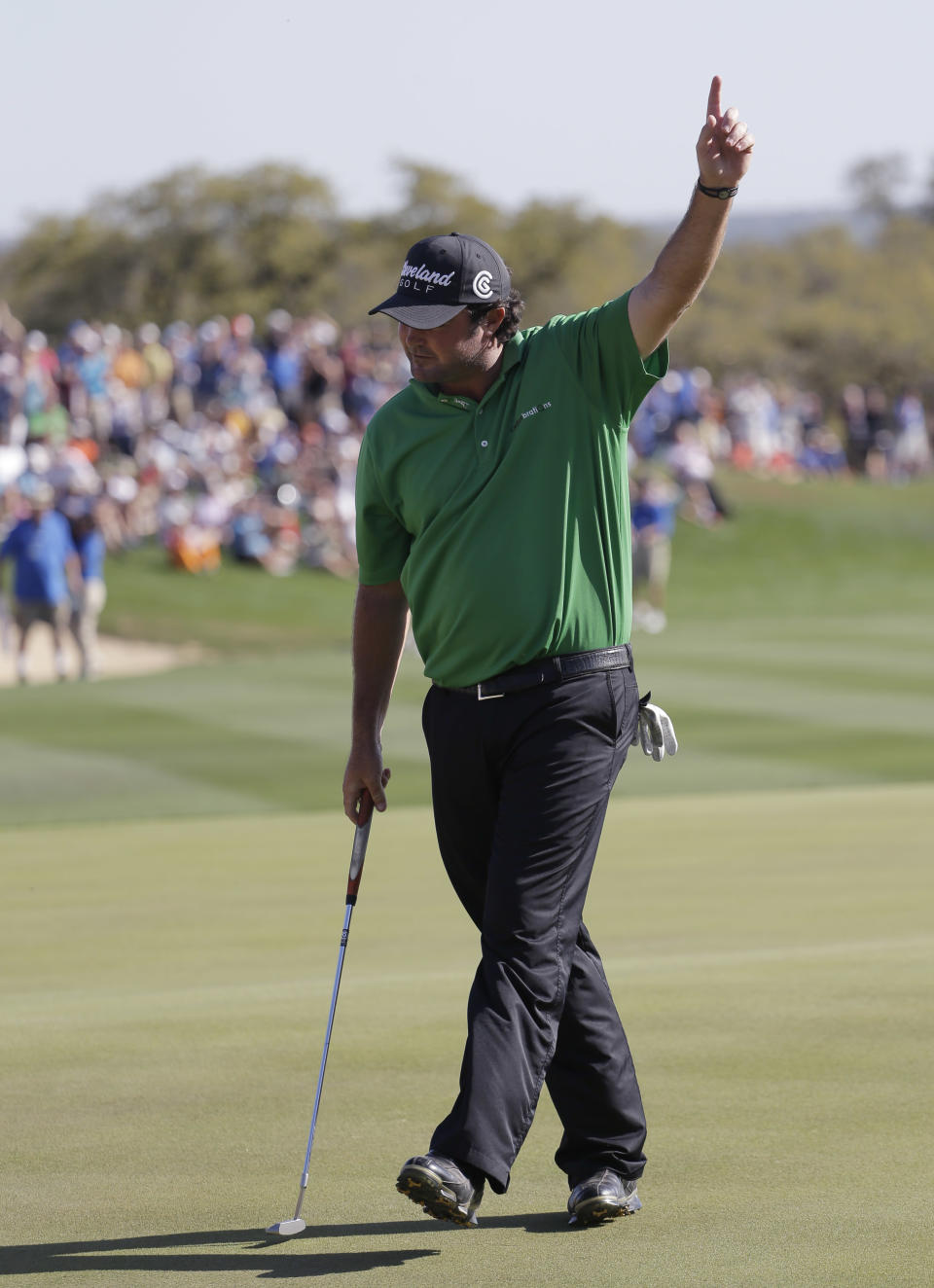 Steven Bowditch, of Australia, gestures after making his final putt to win the Texas Open golf tournament on Sunday, March 30, 2014, in San Antonio. (AP Photo/Eric Gay)