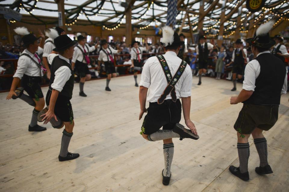 <p>Boys in traditional bavarian Lederhosen perform a “Schuhplattler” dance on the second day of Oktoberfest. (Getty Images/Philipp Guelland) </p>