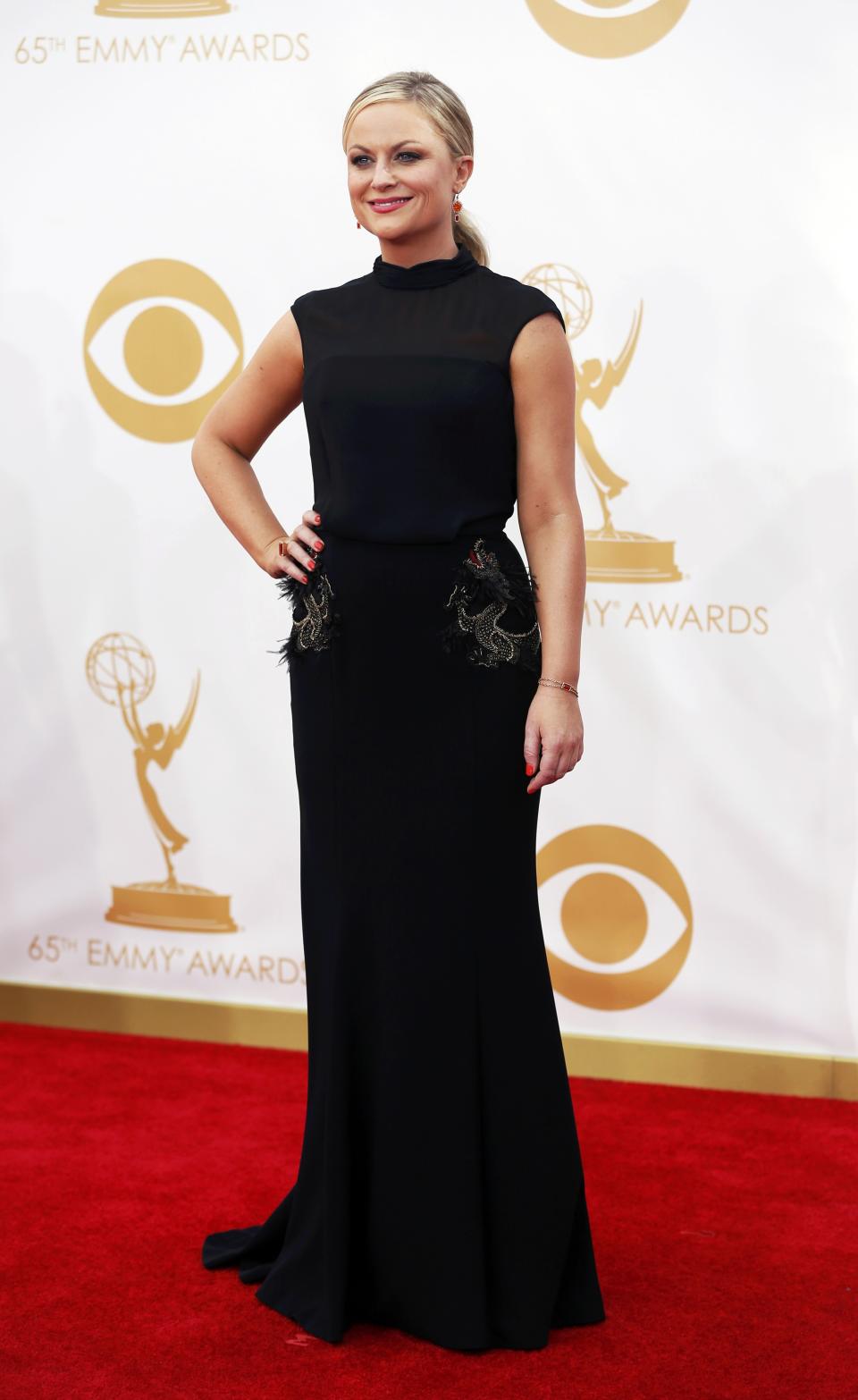 Actress Amy Poelher from NBC's sitcom "Parks and Recreation" arrives at the 65th Primetime Emmy Awards in Los Angeles September 22, 2013. REUTERS/Mario Anzuoni (UNITED STATES Tags: ENTERTAINMENT) (EMMYS-ARRIVALS)