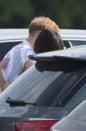 After Prince Harry played his polo game, they were seen in the carpark going in for a smooch.