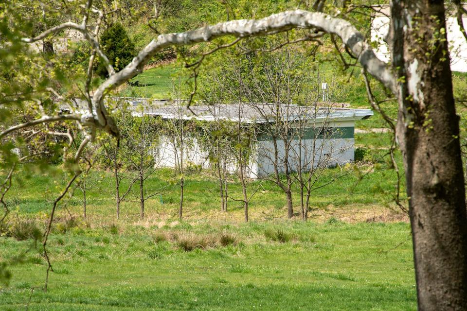 A building from the former Red Lion Country Club can be seen in the distance across what was once golfing on Monday April 23, 2023.