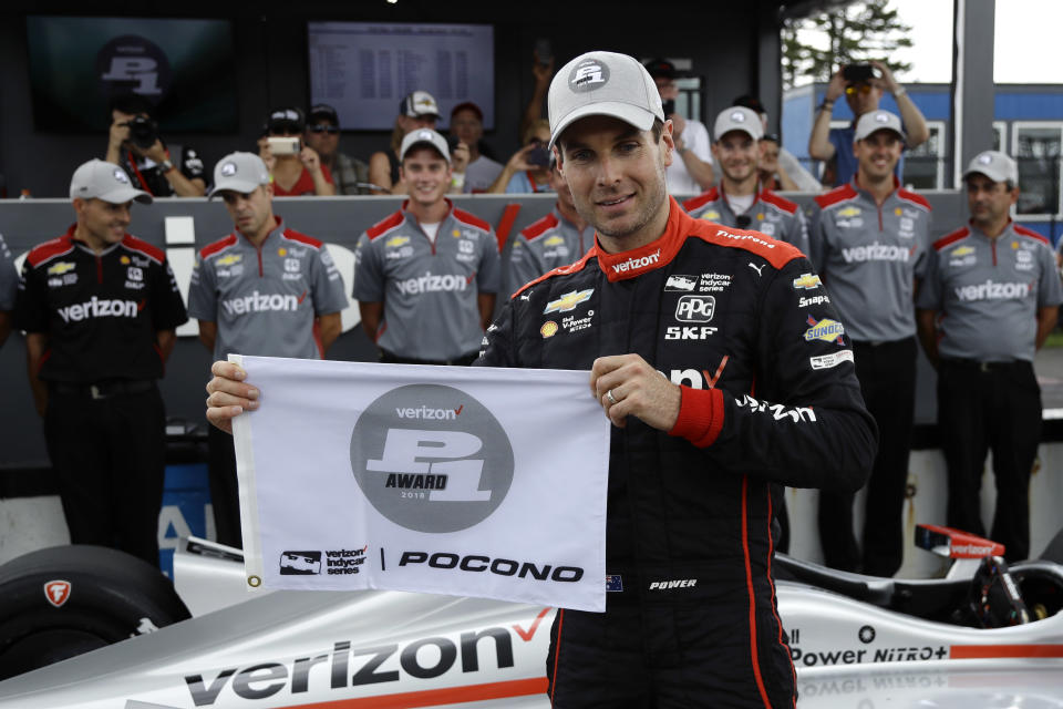 Will Power poses after qualifying on the pole for Sunday's IndyCar series auto race, Saturday, Aug. 18, 2018, in Long Pond, Pa. (AP Photo/Matt Slocum)