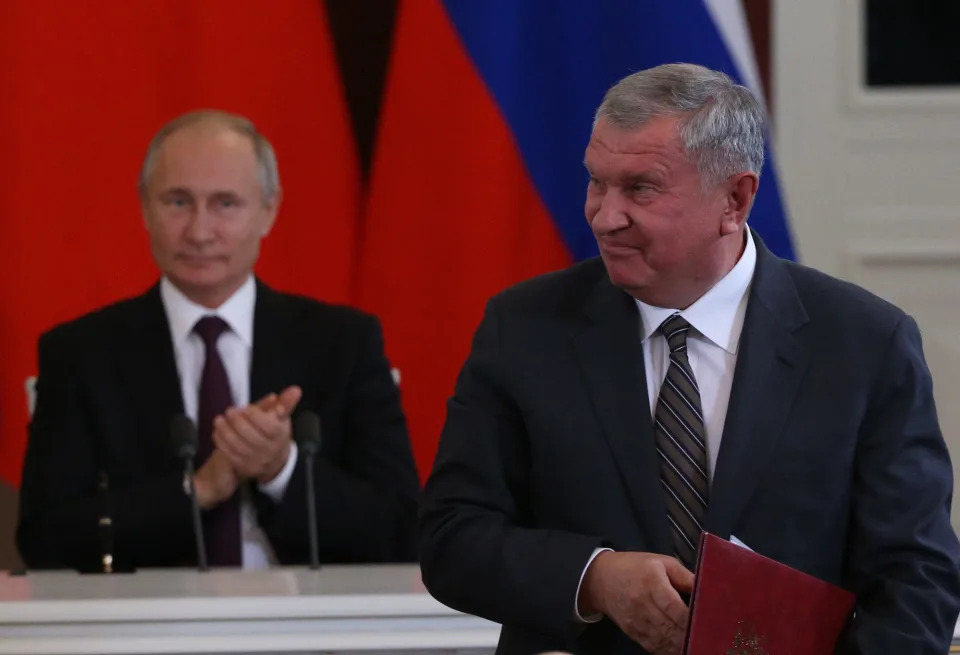 Russian President Vladimir Putin (L) looks on Rosneft President Igor Sechin (R) during Russian-Chinese talks at the Grand Kremlin Palace in Moscow.