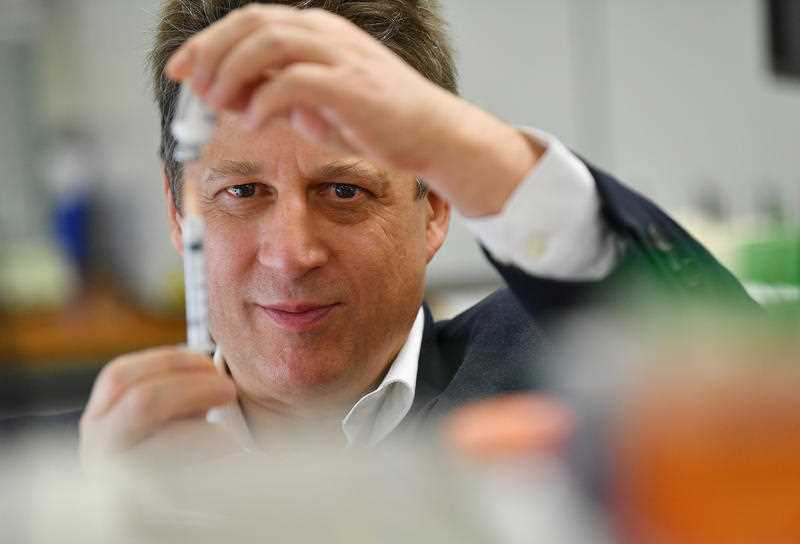 Vaxine research director Nikolai Petrovsky in the Flinders University lab with a vaccine specimen.